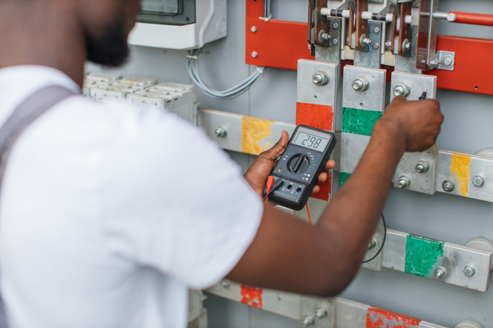 Commercial electrician conducting an electrical panel load assessment for EV charger planning Baltimore commercial properties