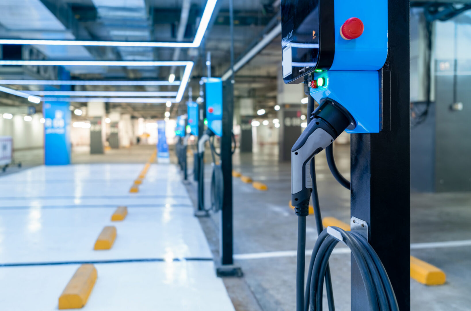 EV charger planning Baltimore commercial properties featuring a row of modern charging stations installed in a commercial parking garage