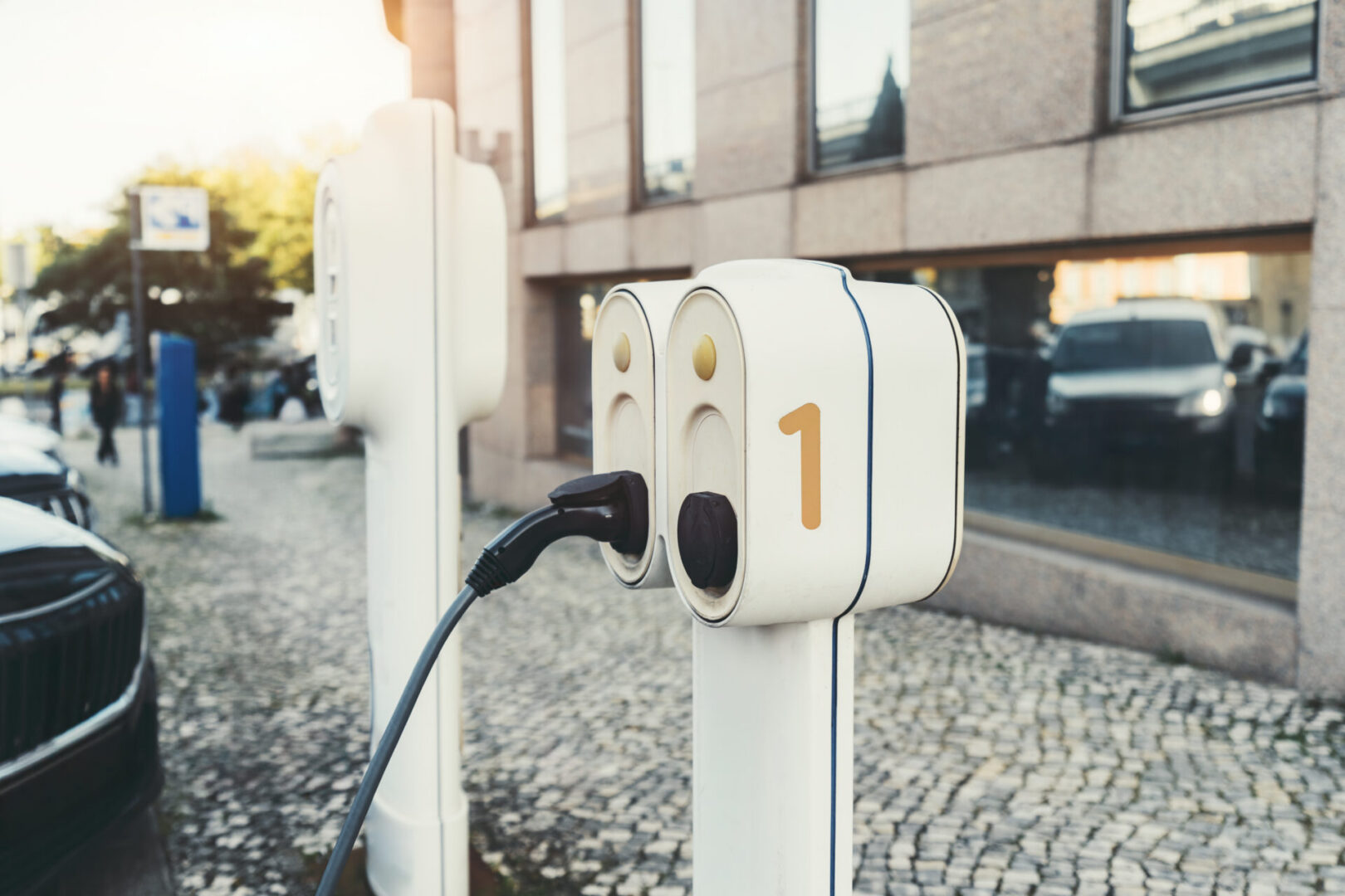 Commercial EV charger installation and site walkthrough planning outside an urban office property