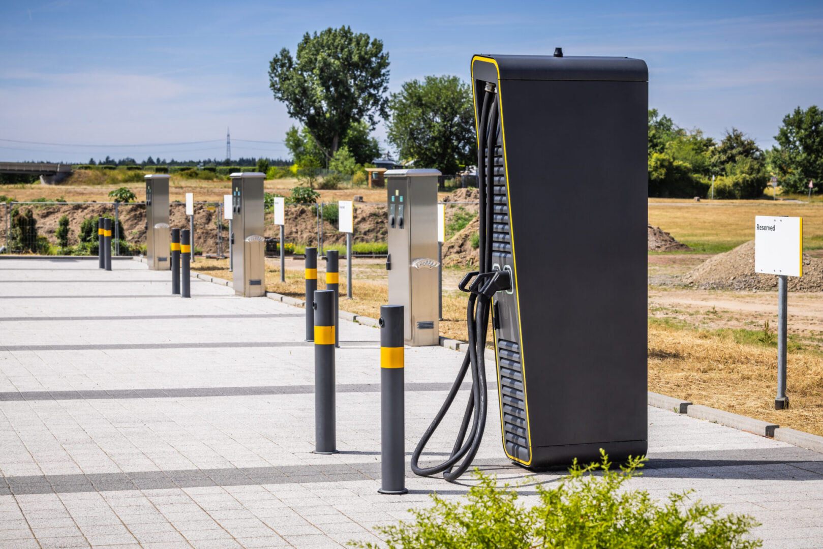 Commercial parking lot prepared for multi-station EV charger installation and infrastructure readiness