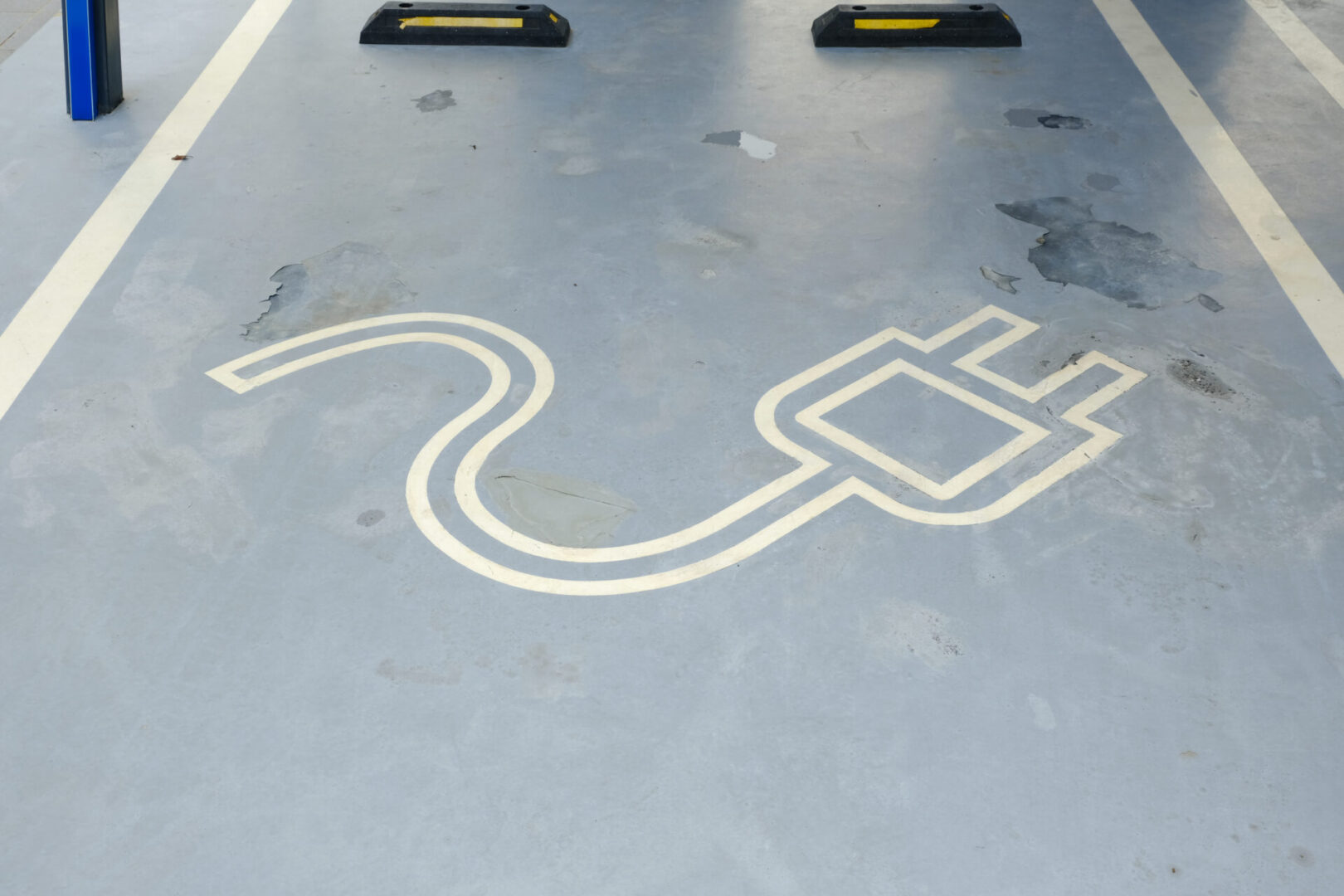 Designated electric vehicle parking stall marking for EV charger planning Baltimore commercial properties